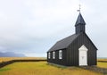 Budakirkja - the black church sits alone among a field of lava rock.